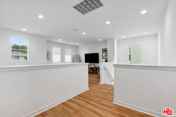 a view of kitchen with furniture and wooden floor