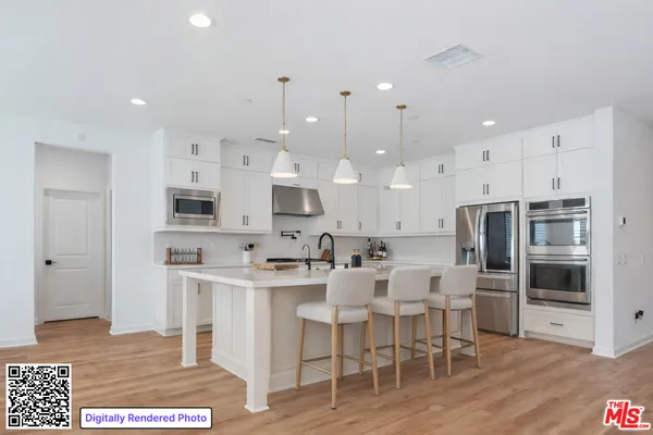 a large kitchen with lots of counter space and appliances