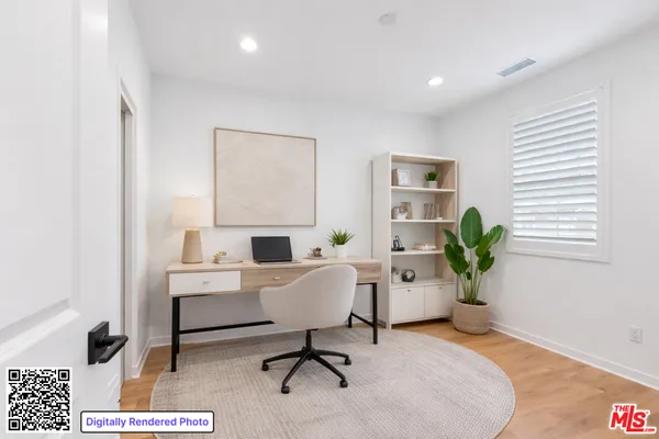 a workspace with furniture and a potted plant