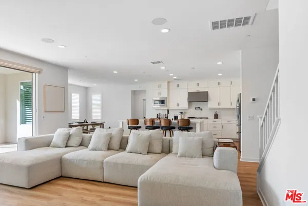 a large room with a couch and a large window