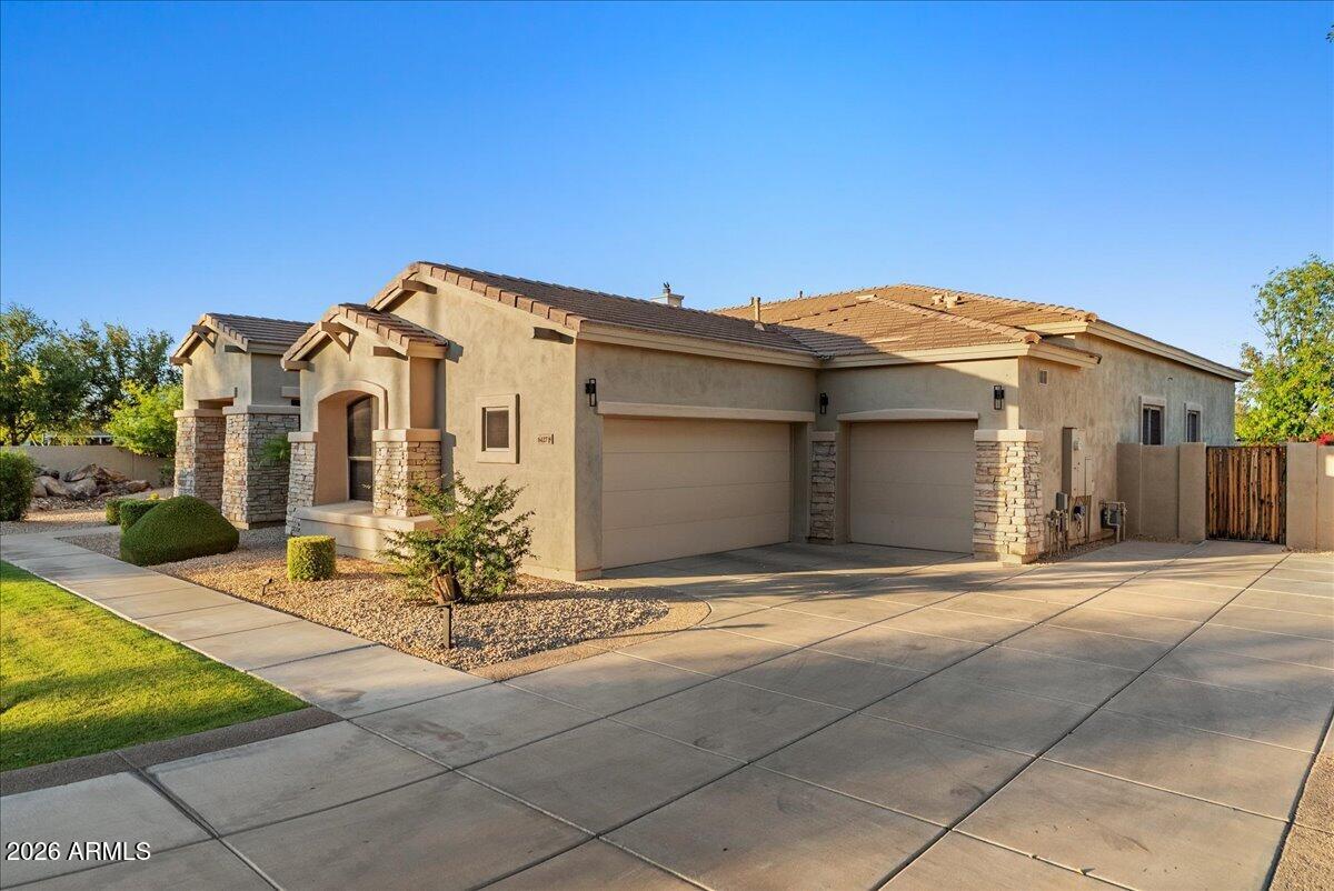 6427 South Magic Court Gilbert, AZ 85298 - Photo 68 of 71 a front view of a house with yard
