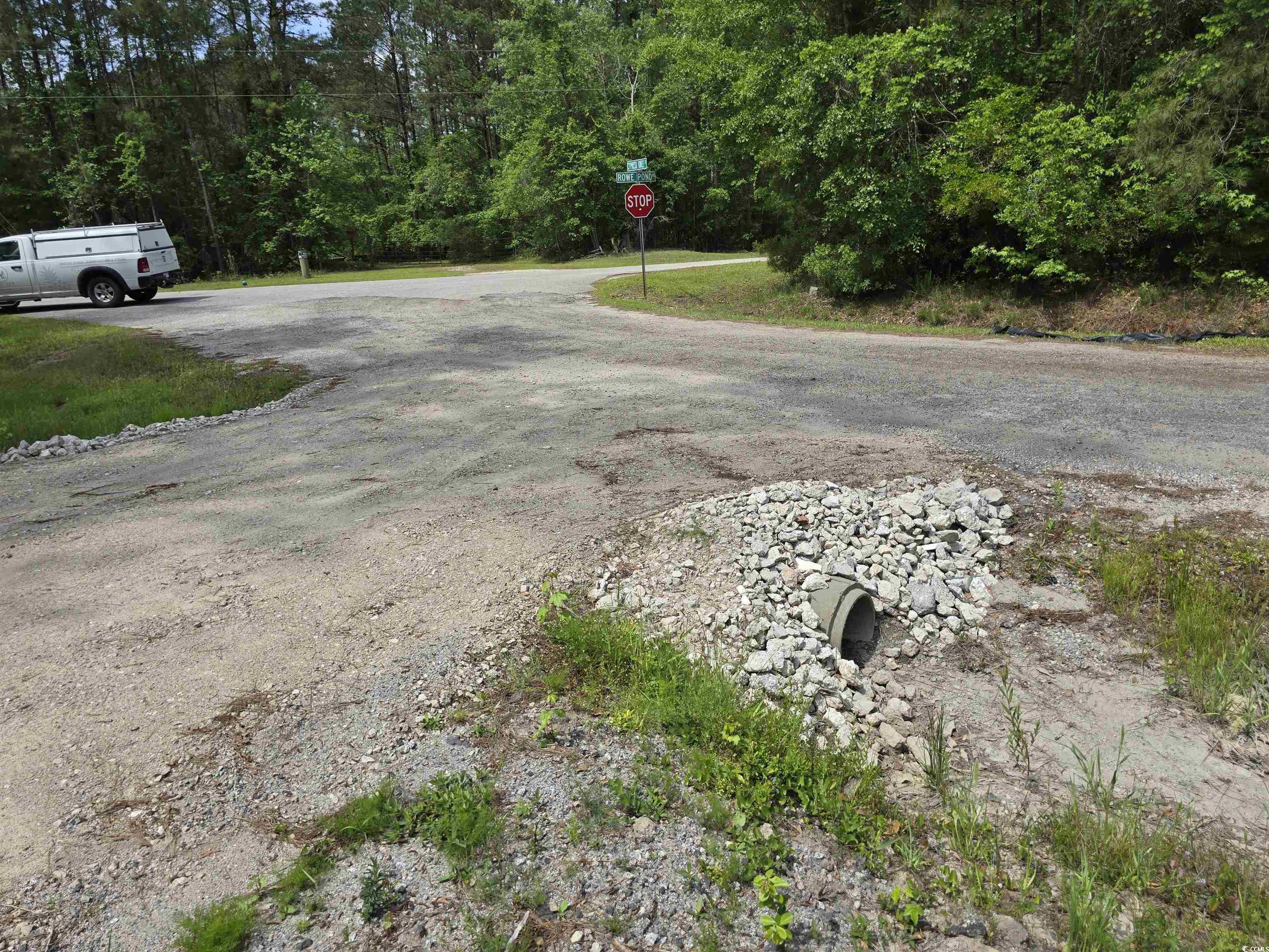 Lot 17 Rowe Pond Road Conway, SC 29526 - Photo 7 of 16 View of asphalt road with traffic signs and a fore