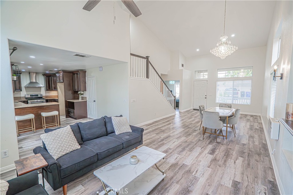 25535 Chisom Lane Stevenson Ranch, CA 91381 - Photo 11 of 37 a living room with furniture and a wooden floor