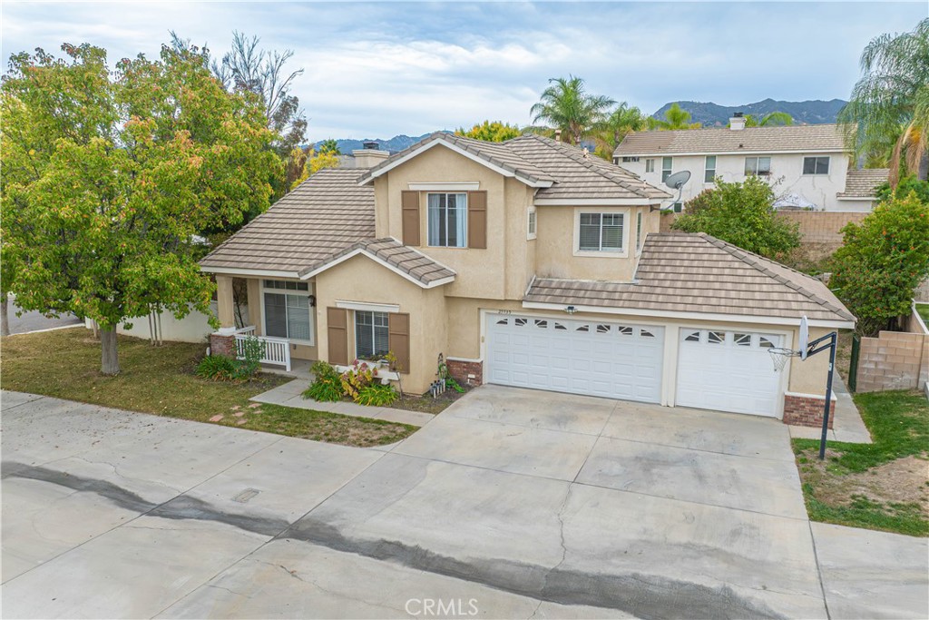 25535 Chisom Lane Stevenson Ranch, CA 91381 - Photo 2 of 37 a view of house with a yard and potted plants