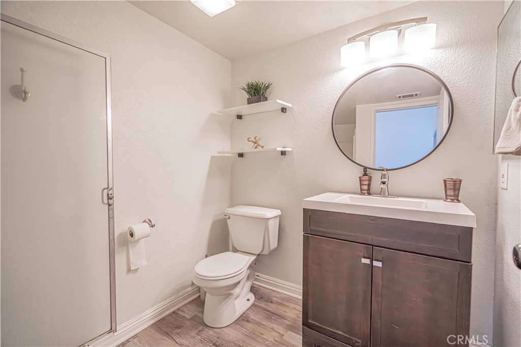 25535 Chisom Lane Stevenson Ranch, CA 91381 - Photo 21 of 37 a bathroom with a toilet sink and mirror