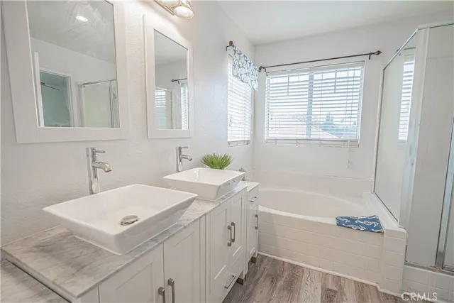 a white bath tub sitting next to a window