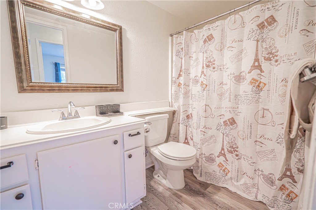25535 Chisom Lane Stevenson Ranch, CA 91381 - Photo 31 of 37 a bathroom with a sink toilet and mirror