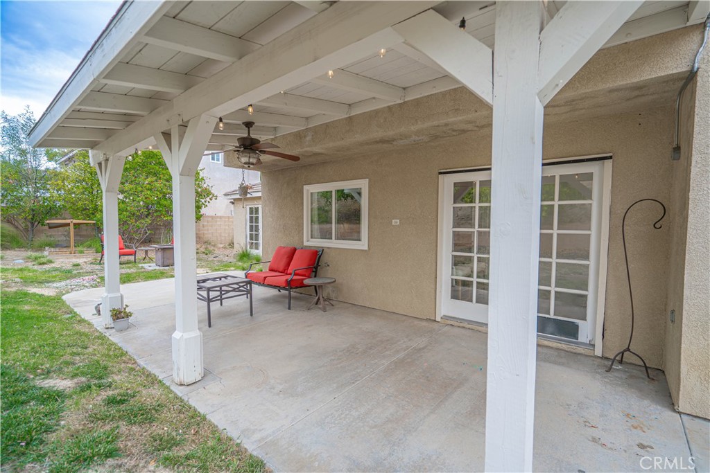 25535 Chisom Lane Stevenson Ranch, CA 91381 - Photo 35 of 37 a view of a porch with chairs and backyard