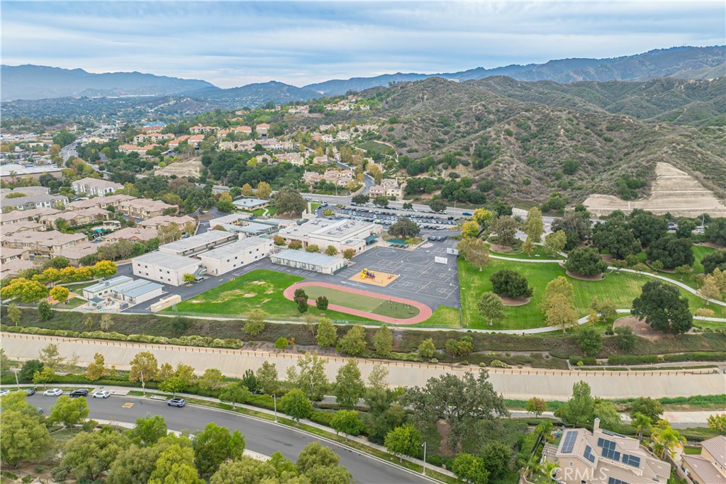 25535 Chisom Lane Stevenson Ranch, CA 91381 - Photo 37 of 37 an aerial view of lake residential house with swimming pool and green space