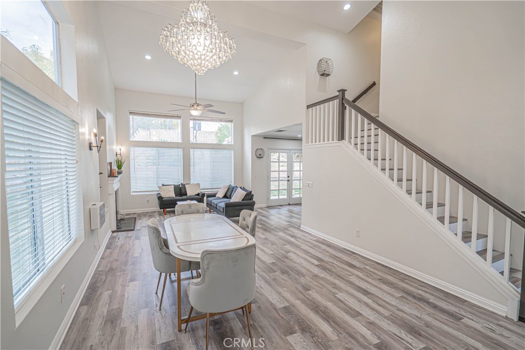 25535 Chisom Lane Stevenson Ranch, CA 91381 - Photo 8 of 37 a view of a dining room with furniture window and wooden floor