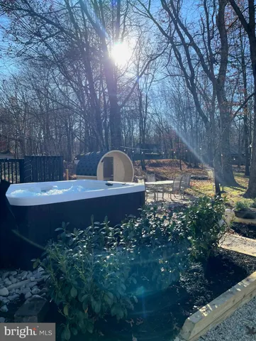 a view of a backyard with sitting area