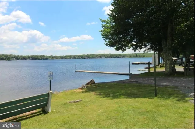 a view of a pool and a yard