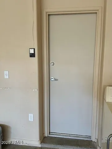 a view of an empty room with a window