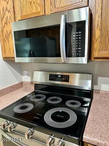 a kitchen with a stove and a microwave