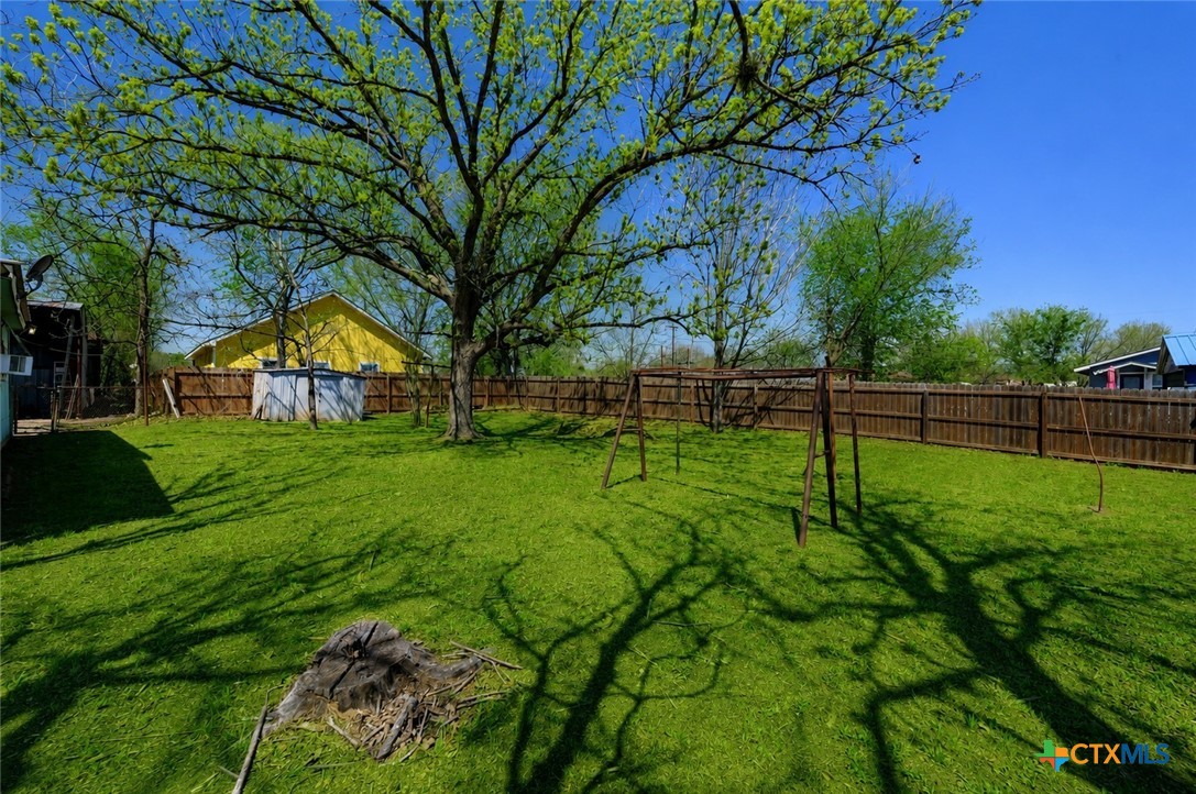 1631 East Fannin Street Luling, TX 78648 - Photo 26 of 27 a view of yard with green space