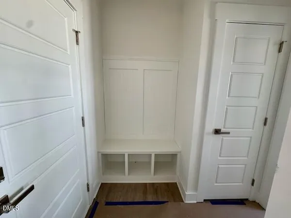 a view of storage and utility room with a window