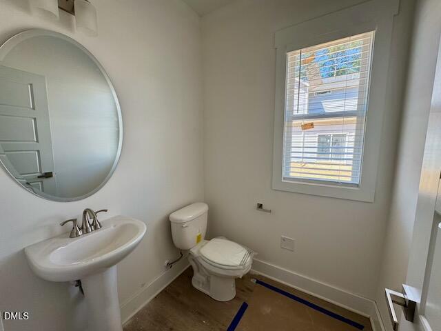 218 George Street, Unit A Four Oaks, NC 27524 - Photo 15 of 42 a bathroom with a sink a toilet and a mirror