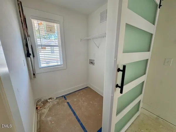 a bathroom with a glass door shower