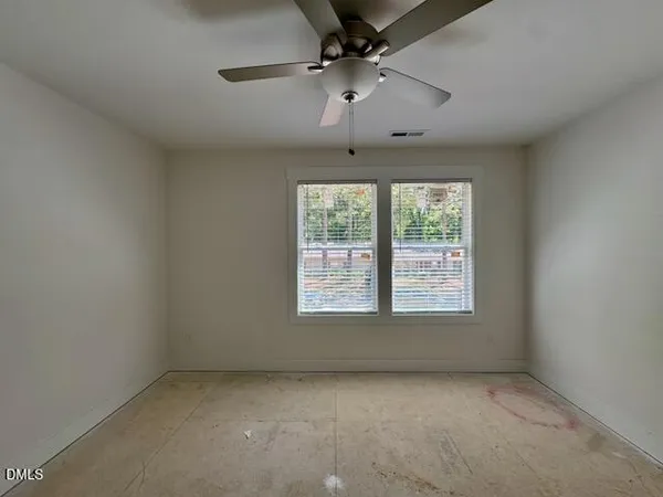 en empty room with windows