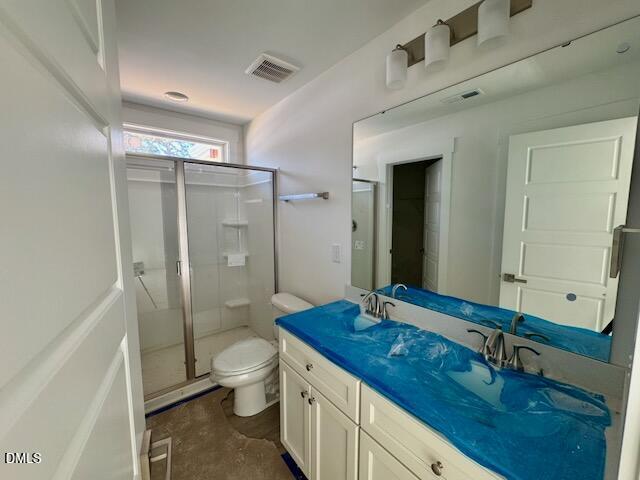 218 George Street, Unit A Four Oaks, NC 27524 - Photo 27 of 42 a bathroom with a double vanity sink toilet mirror and shower