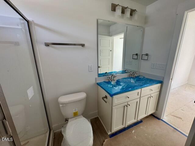 218 George Street, Unit A Four Oaks, NC 27524 - Photo 28 of 42 a bathroom with a granite countertop toilet and a sink