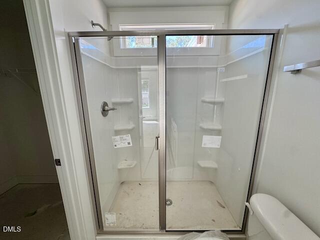 218 George Street, Unit A Four Oaks, NC 27524 - Photo 29 of 42 a bathroom with a glass door shower
