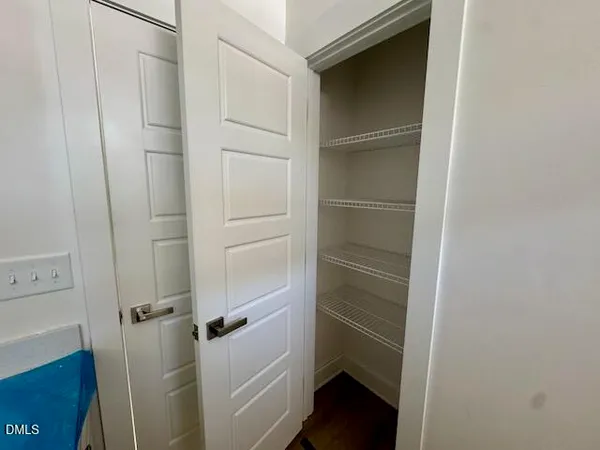a view of an empty walk in closet