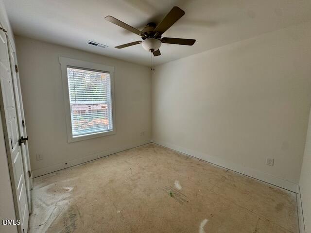 218 George Street, Unit A Four Oaks, NC 27524 - Photo 39 of 42 an empty room with a ceiling fan and window