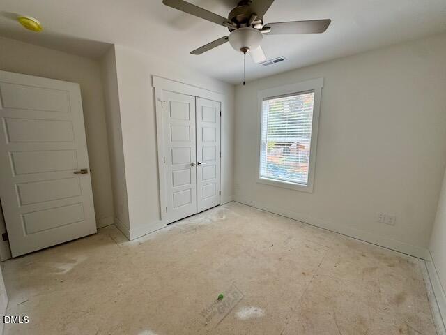 218 George Street, Unit A Four Oaks, NC 27524 - Photo 40 of 42 an empty room with a ceiling fan and window