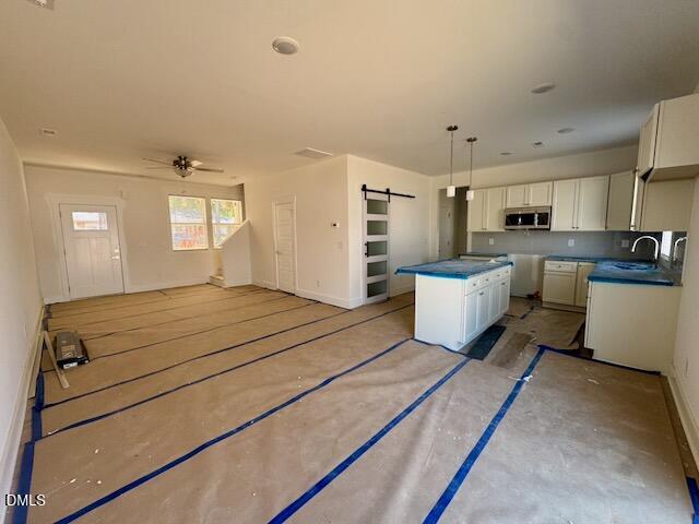 218 George Street, Unit A Four Oaks, NC 27524 - Photo 4 of 42 a room with a bed and a view of kitchen