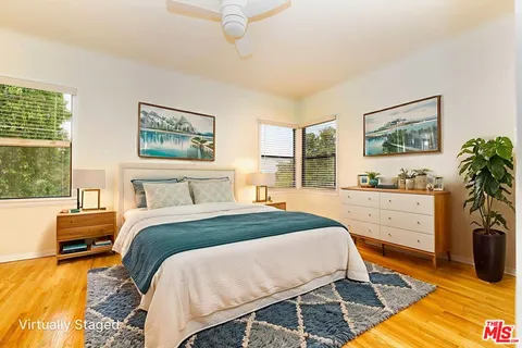 a bed room with a bed and a window