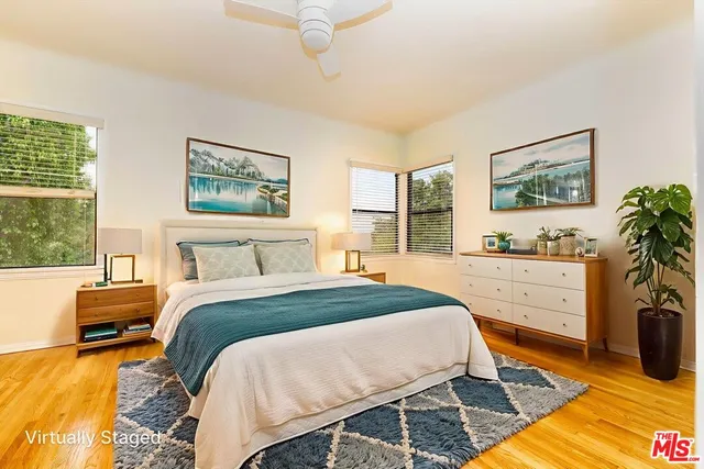 a bed room with a bed and a window