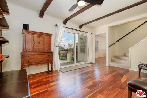 a view of front door with wooden floor