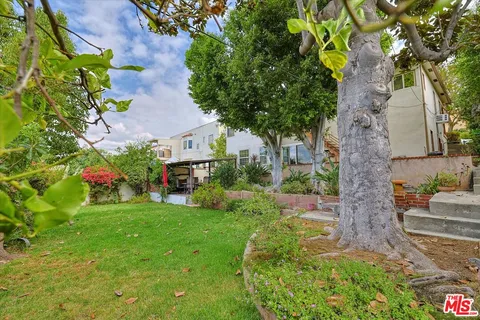 a view of a house with a back yard