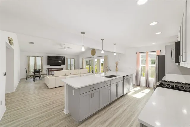 a bedroom with a bed mirror and window