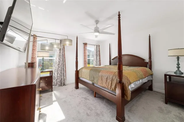 a bedroom with a bed and a mirror