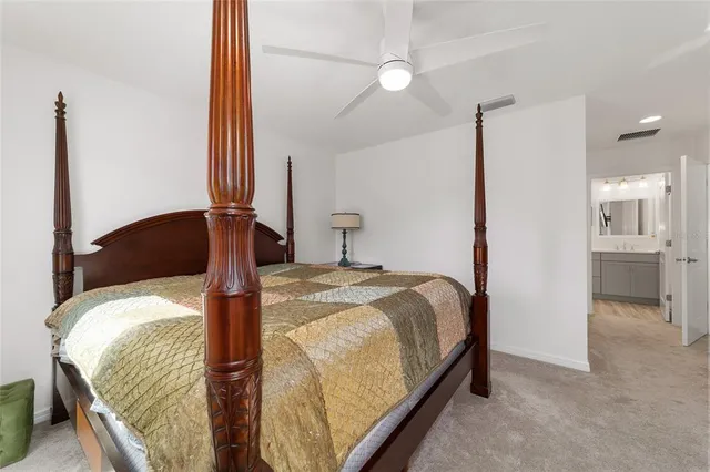 a bathroom with a double vanity sink toilet and shower