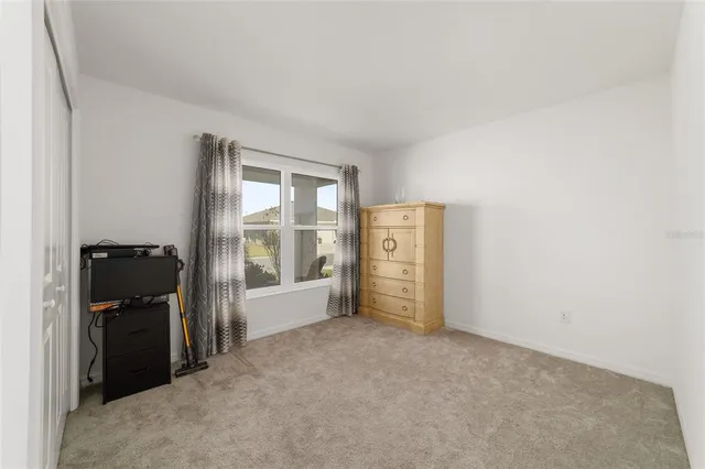 a bathroom with a tub shower and sink