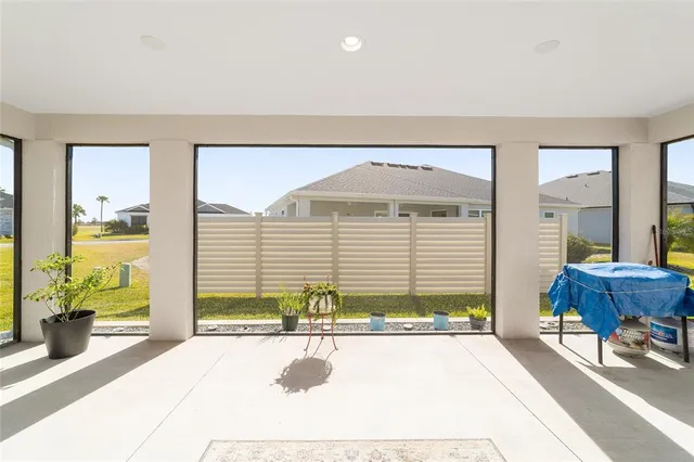 a front view of a house with outdoor seating