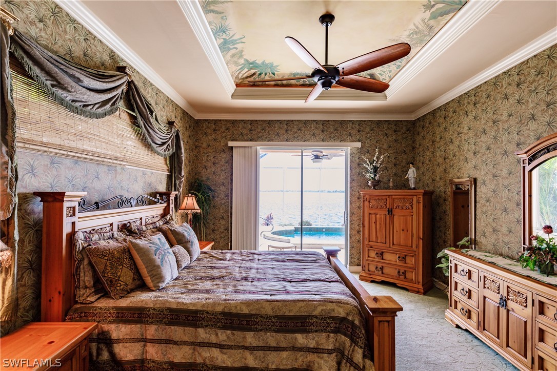5727 Riverside Drive Cape Coral, FL 33904 - Photo 11 of 35 a bedroom with furniture and a mirror