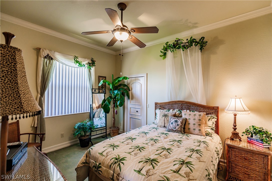 5727 Riverside Drive Cape Coral, FL 33904 - Photo 17 of 35 a bedroom with a bed and a potted plant