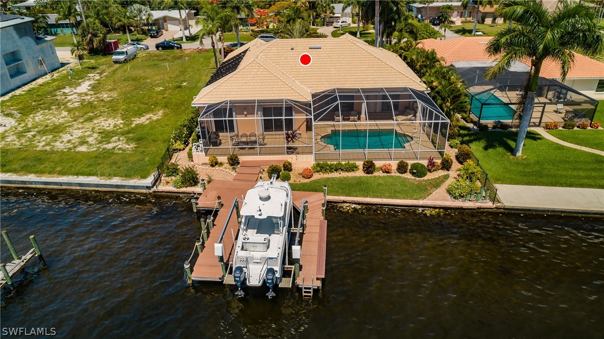 5727 Riverside Drive Cape Coral, FL 33904 - Photo 31 of 35 swimming pool view with a outdoor seating
