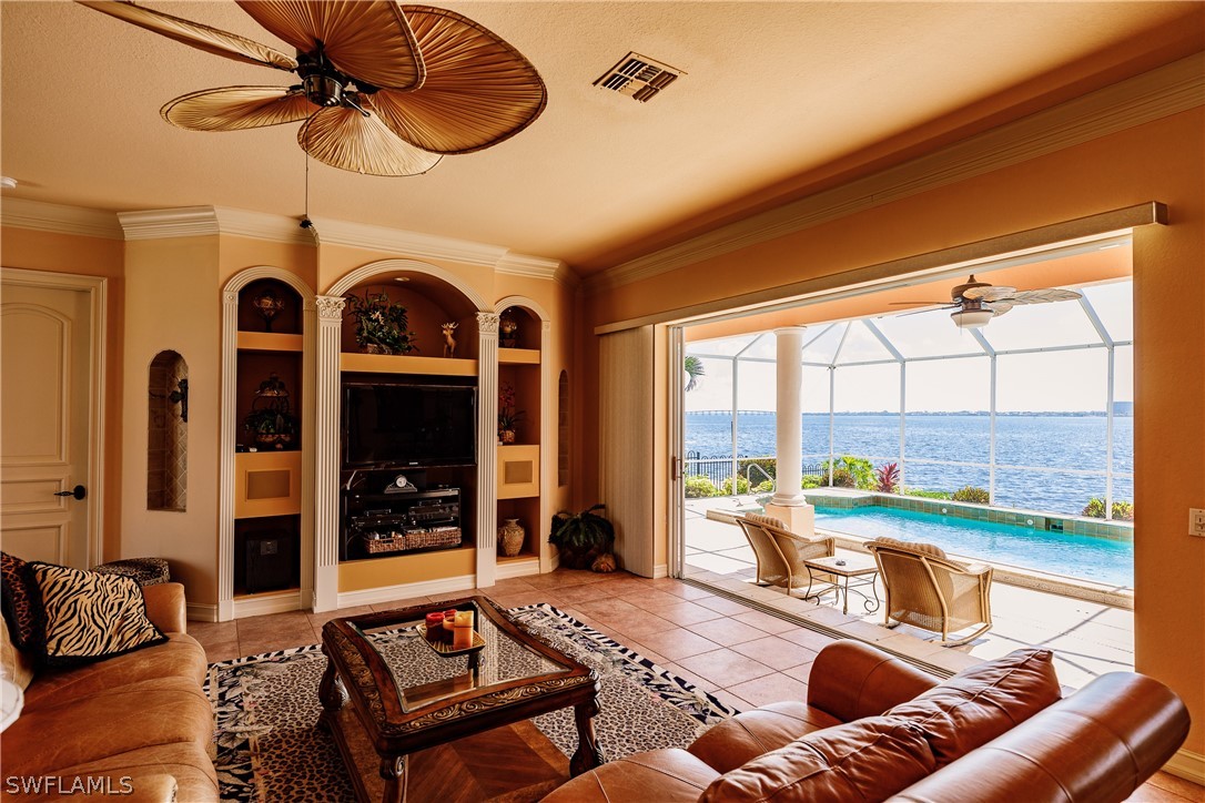 5727 Riverside Drive Cape Coral, FL 33904 - Photo 4 of 35 a living room with furniture and a large window