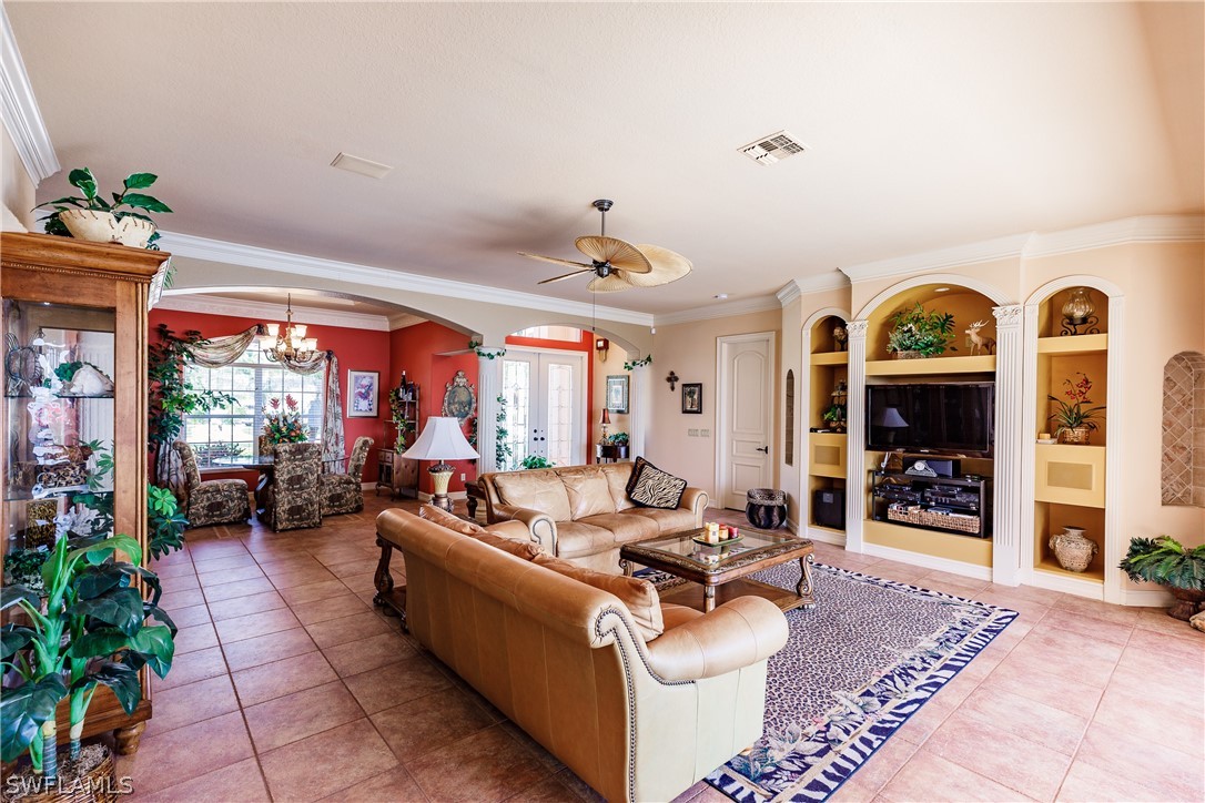 5727 Riverside Drive Cape Coral, FL 33904 - Photo 5 of 35 a living room with furniture and a fireplace