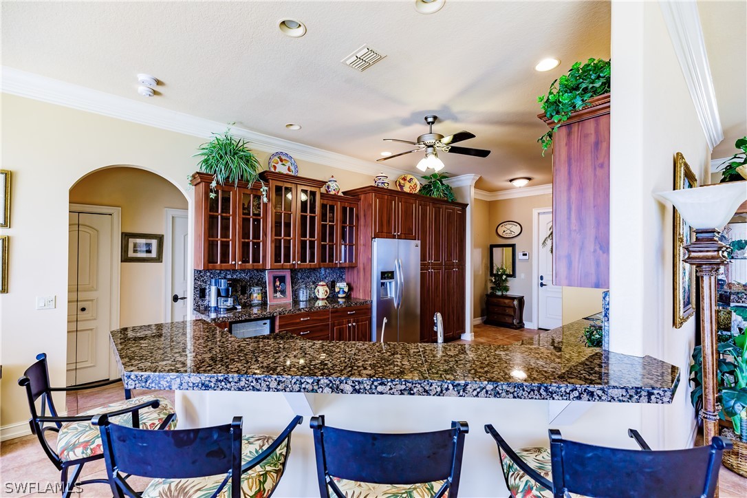 5727 Riverside Drive Cape Coral, FL 33904 - Photo 6 of 35 a view of living room kitchen and dining room
