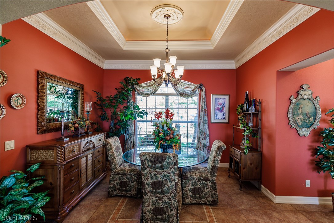 5727 Riverside Drive Cape Coral, FL 33904 - Photo 9 of 35 a view of a dining room with furniture window and entryway