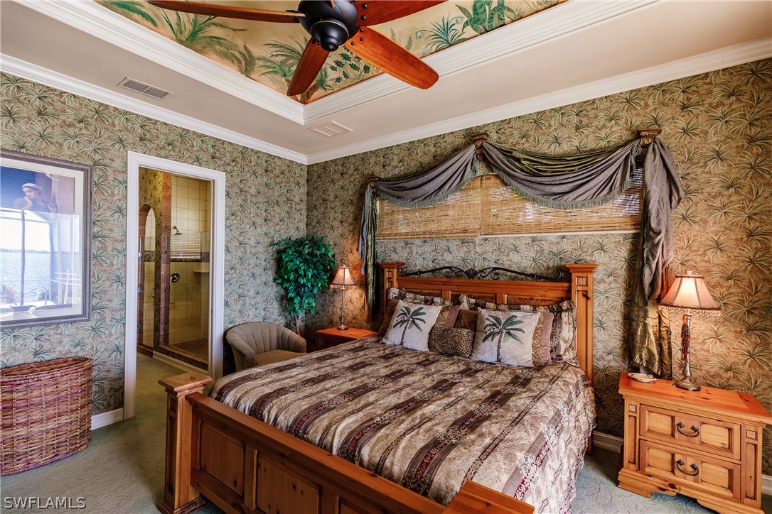 5727 Riverside Drive Cape Coral, FL 33904 - Photo 10 of 35 a bed sitting in a bedroom next to a window