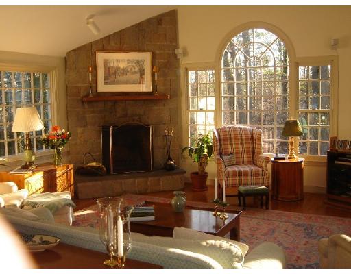 88 Hampshire Road Wellesley, MA 02481 - Photo 12 of 28 a living room with furniture a fireplace and a floor to ceiling window