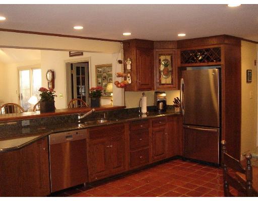 88 Hampshire Road Wellesley, MA 02481 - Photo 16 of 28 a kitchen with a refrigerator and a sink