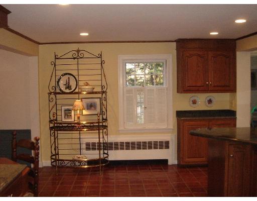 88 Hampshire Road Wellesley, MA 02481 - Photo 17 of 28 a kitchen with a refrigerator and a stove